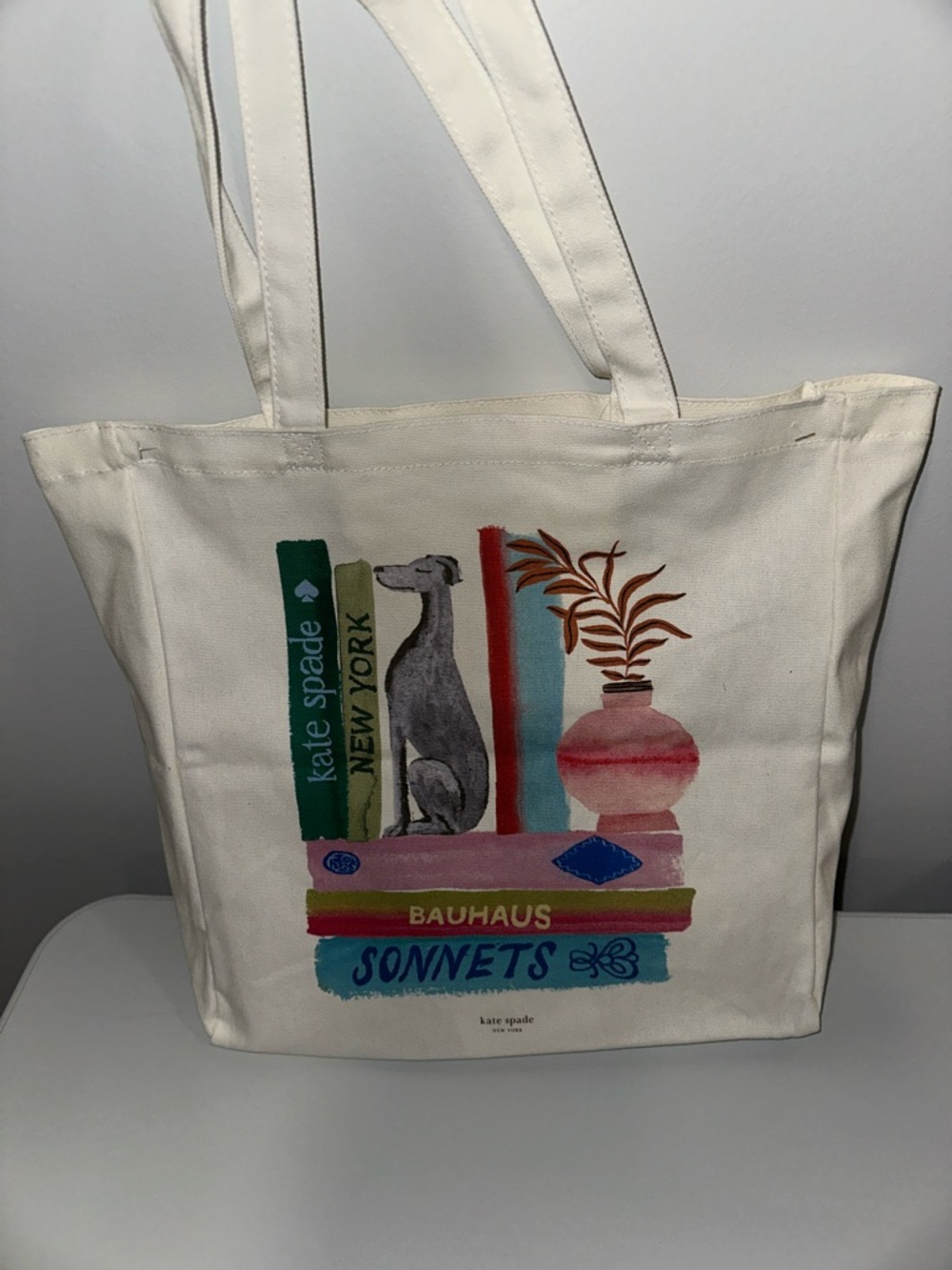 kate spade Ivory Multi Bookshelf Dog Figurine Canvas Tote Bag - Picture 4 of 9
